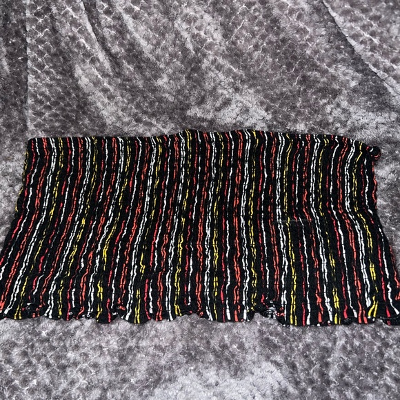 This is a black tube top with red, yellow and white stripes. - Picture 2 of 3